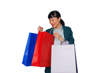 Asian woman enjoying shopping, carrying colorful bags, looking inside packages with happiness, transparent background