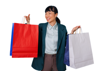 Asian woman smiling, happily holding shopping bags, enjoying consumerism, successful retail therapy, transparent background