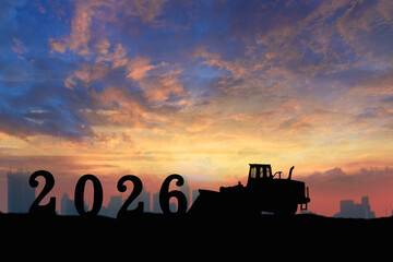 Concept happy new year 2026, Wheel loader silhouette  .On sunset backgrounds