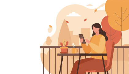 Woman using phone and drinking coffee on an urban autumn balcony Digital lifestyle concept