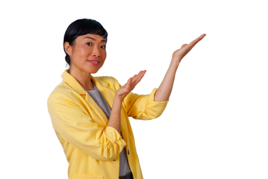 Asian woman in yellow jacket presenting and showing with open hands, introducing new product or service - Powered by Adobe
