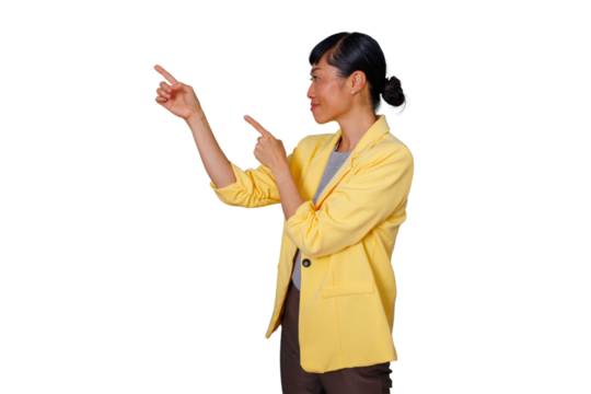 Asian businesswoman in yellow jacket pointing and presenting to the left side with both hands, transparent background