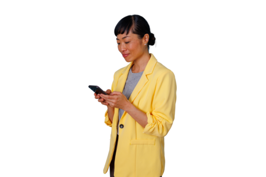 Asian businesswoman communicating using smartphone isolated. Woman in yellow blazer texting, scrolling, or browsing content on mobile phone