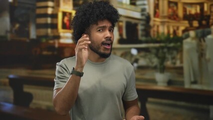 Man passionately speaking in an ornate church setting, conveying a sense of deep emotion and engagement with an unseen audience.