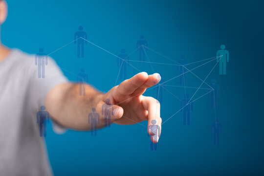 Connecting people and community concept using digital technology and human interaction on blue background.