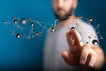 Close-up of a man's finger touching a network, representing data connection and digital concepts. Suitable for