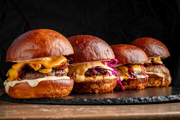 Savor the delicious details of gourmet burgers with rich toppings, melted cheese, and savory sauces
