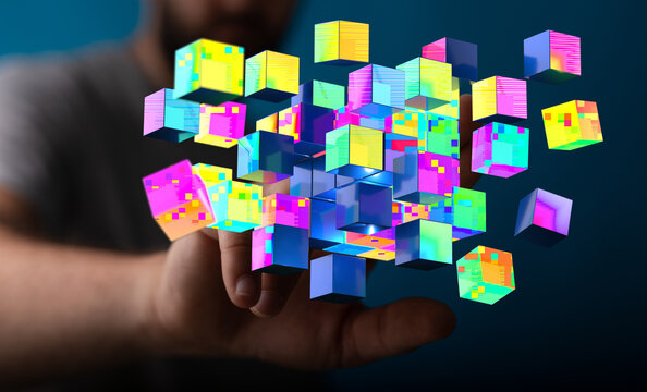 Digitally generated futuristic 3D cubes floating from hand, representing data processing, technology, and innov