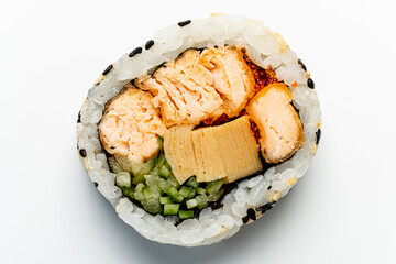 Delicate sushi roll showcases layers of salmon, vegetables, and rice, ready to delight taste buds
