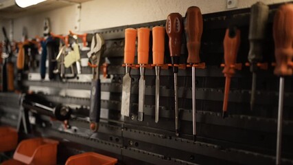 Carpenters hand tools on wall in a workshop - Powered by Adobe