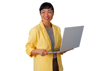 Asian businesswoman smiling, holding a laptop. She is connecting, innovating, and working in a modern professional environment