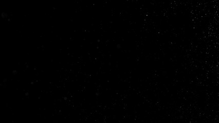 Falling snowflakes isolated on black background. Winter snow overlay texture for VFX, compositing, motion graphics and atmospheric effects