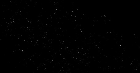 Fototapeta premium Falling snowflakes isolated on black background. Winter snow overlay texture for VFX, compositing, motion graphics and atmospheric effects