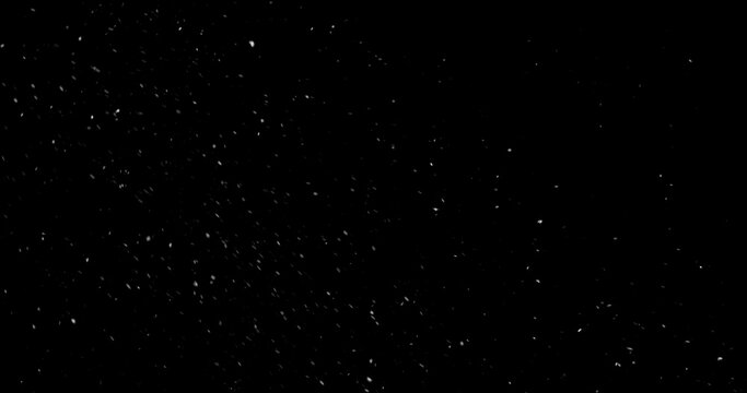 Falling snowflakes isolated on black background. Winter snow overlay texture for VFX, compositing, motion graphics and atmospheric effects