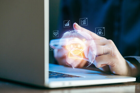 Hands interacting with holographic artificial intelligence display above a laptop in a modern workspace