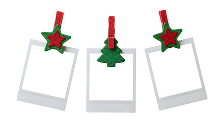 Collection of three blank instant photo prints clipped with festive red stars and a green Christmas tree, isolated on a white background for holiday design