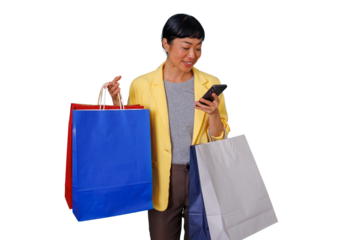 Asian woman shopping, holding colorful bags and checking smartphone, practicing digital consumerism