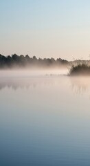 Obraz premium A calm morning scene features mist gently rising over a glass-like water surface, reflecting soft light, fostering deep peace and stillness ,open ,beauty ,soothing