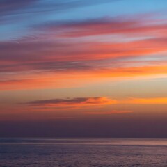 Naklejka premium landscape, vibrant sunset, dramatic sky, ocean horizon, colorful clouds, serene atmosphere, tranquil seascape, atmospheric lighting, scenic natural beauty, picturesque coastal view 