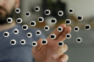 Hand touching a network of connected folders representing data management, digital organization, and cloud stor