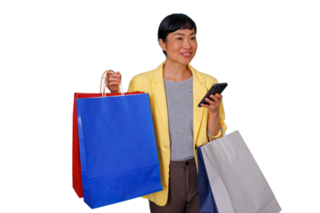 Asian woman carrying colorful shopping bags and a smartphone, enjoying a shopping experience with a happy expression
