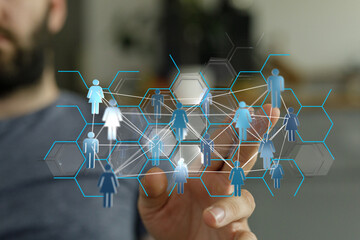 Close up of a hand interacting with a digital network of people. Modern business, networking...