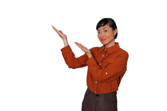Asian woman smiling and presenting with open hands, showing copy space on transparent background for advertising - Powered by Adobe