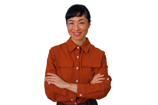 Asian businesswoman smiling, crossing arms, showing confidence, professionalism, and leadership. Posing on a transparent background