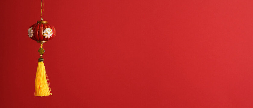 Chinese lantern with yellow tassel on red background, Сopy space for Lunar New Year and celebration design.