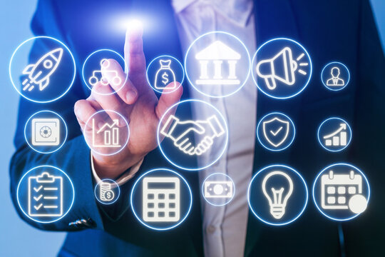 Business professional interacting with digital icons representing finance, technology, and communication tools in a modern office setting