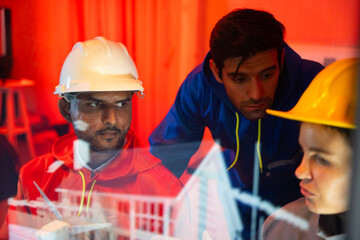 Modern construction and engineering Team Collaborating on Futuristic Holographic Interface Analyzing. Holographic Technology for Innovative house Development Planning