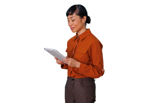 Asian businesswoman standing, holding a digital tablet, and browsing content. Transparent background for versatile use