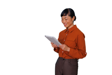 Asian business woman smiling while using a digital tablet, representing technology integration and mobile communication for business professionals
