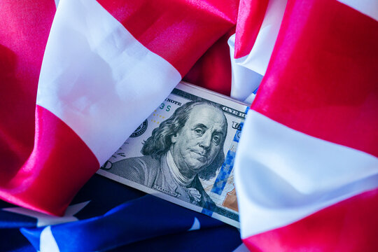 Money wrapped in American flag symbolizing patriotism and national pride during a festive celebration - Powered by Adobe