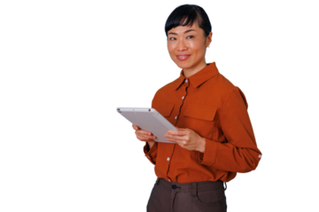 Asian businesswoman smiling and holding a tablet, using technology for a professional online business