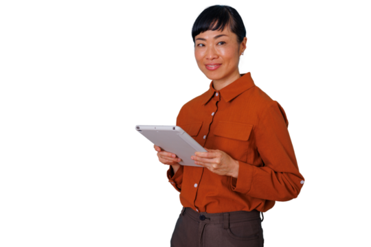 Asian businesswoman smiling and holding a tablet, using technology for a professional online business - Powered by Adobe
