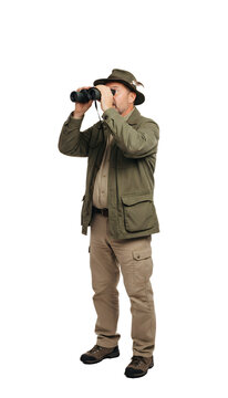 A male birdwatcher binoculars to his eyes with a look of sudden discovery