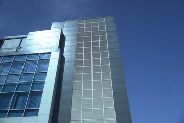 Obraz premium modern building with blue glass windows