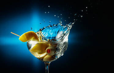 Martini with green olives and lemon.