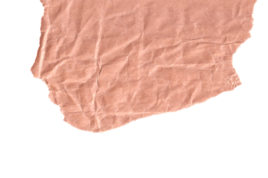 A close-up, top-down view of a torn piece of light brown, crumpled paper with a textured surface and irregular edges isolated on a black background.