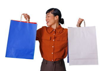 Asian woman happily shopping, carrying blue and white shopping bags, experiencing joy and consumer satisfaction