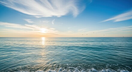 Obraz premium Tranquil Ocean Sunset with Wispy Clouds and Horizon View