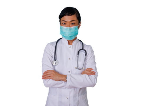 Asian female doctor wearing face mask and lab coat, arms crossed, standing confident on transparent background