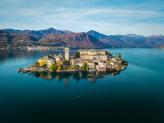 Aerial view of the island of Orta San Giulio, in the middle of Orta Lake (Piedmont, Northern Italy). Is a glacial origin lake and its little island is an ancient home of a cloistered nuns.