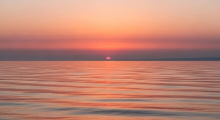 Fototapeta premium Serene Ocean Sunset Horizon with Calm Water and Vibrant Sky Hues