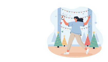 Happy woman decorating with colorful Christmas lights controlling them using a smartphone application