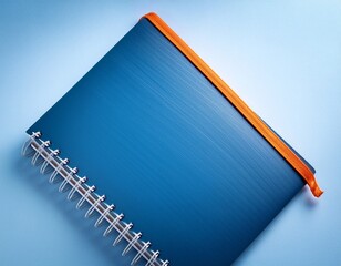 blue spiral notebook with orange elastic
