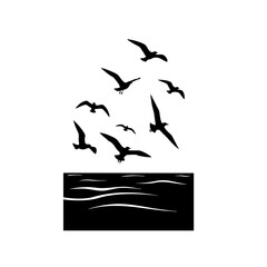 Silhouetted seagulls soaring above stylized ocean waves, creating a minimalist seascape © Hanafi