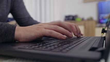 Close-up shot captures male hands swiftly typing on a laptop keyboard, highlighting the process of remote work, study, or communication. - Powered by Adobe