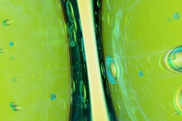 Luminous flowing green abstract shapes enriched with microbubbles, perfect for eco-brand campaigns, futuristic motion assets, and nature-tech visuals